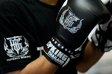 Close up of lace up gloves on fighter