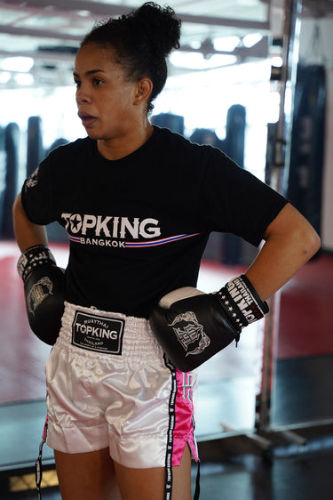 UFC fighter Dione Barbosa wearing Top King USA Gear - Black top king t-shirt, White and pink muay thai shorts and Pro Top King Boxing gloves.