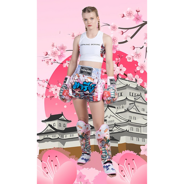 Marie Ruumet in Top King USA gear -wearing Pink Boxing Gloves, Pink Shin Guards, Pink Muay Thai shorts all in Japanese design with a cartoon Japan background