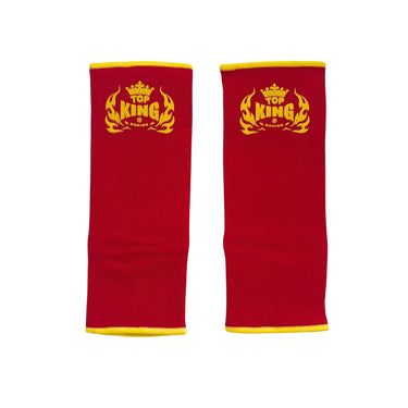 Top King red ankle guards with yellow logo, front view