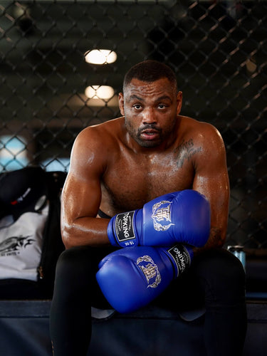UFC fighter Cesar Almeida wearing Blue Top King Gloves. 