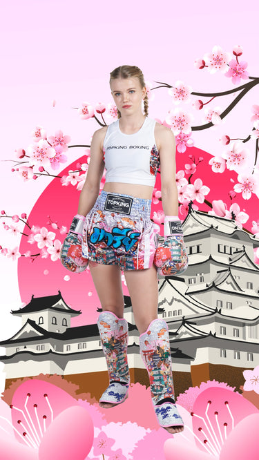 Marie Ruumet in an Muay Thai outfit: Pink Shin guards, Pink boxing gloves, Pink Muay Thai shorts all with Japanese culture design. 