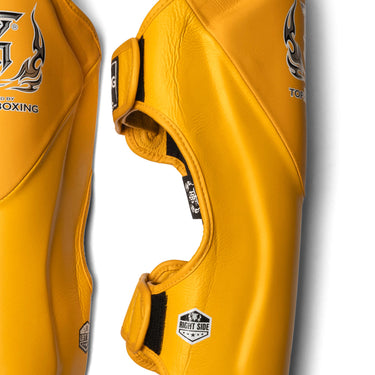 Top King Shin Guards in Yellow. Shin Guards used for Muay Thai, MMA and Kickboxing. Side view.